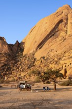 Campground in front of a massive rock face near Spitzkoppe, Spitzkoppe, Namibia