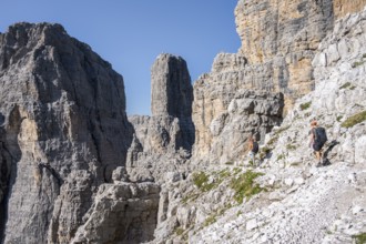 Mountaineers on the Bocchette Centrale band trail, via ferrata in the Brenta Mountains,