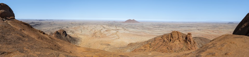 Panoramic picture of dry, rocky desert landscape under blue sky, Spitzkoppe, Namibia
