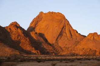 Impressive rocks in bright shades of red in the light of sunset near Spitzkoppe, Spitzkoppe,