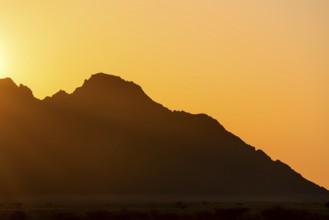 Rugged mountain silhouette at dusk, Spitzkoppe, Namibia