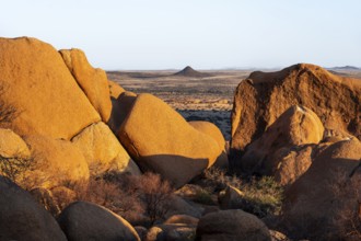 Impressive granite rocks in the barren Spitzkoppe desert with warm evening light, Spitzkoppe,