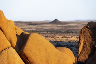 Impressive rock formations offer a wide view of the dry desert plain of Spitzkoppe, Spitzkoppe,