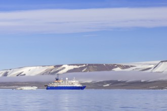 Antarctic cruise ship MV Sea Spirit of Poseidon Expeditions with eco-tourists cruising along the