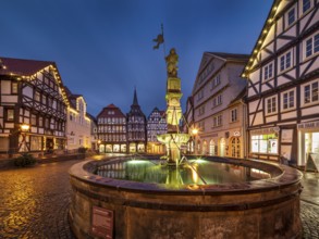 Market square with Roland fountain, cobblestones and half-timbered houses in the historic old town