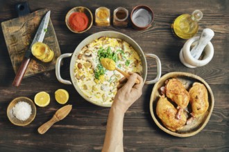 A person adds cardamon into pan with chopped mushrooms, onion, herbs and cream. Adding flavour to