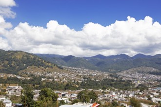 City view of Nahualá between green mountains, Highlands, Sololá Department, Guatemala