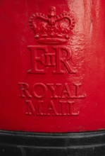 Red Royal Mail mailbox with crown and royal monogram, London, England, Great Britain