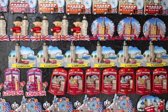 Various colorful London souvenir magnets on a wall, London, England, Great Britain