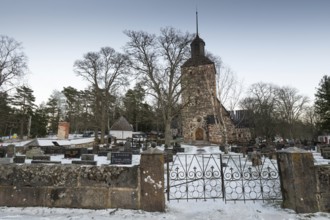 Church building in a snowy cemetery, Korpoström, Korpo or Korppo, southwestern archipelago, Finland