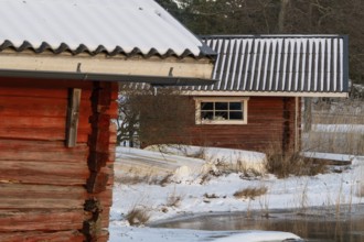 Snowy wooden huts in a winter landscape, Korpoström, Korpo or Korppo, southwestern archipelago,