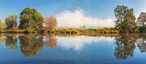 Autumn by the river Saale in the Lower Saale Valley nature park Park, fog in the background,