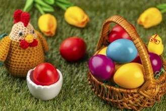 A basket of colorful Easter eggs next to a chicken figurine