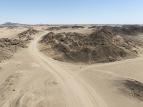 Aerial view, dry barren mountains in Moon Valley, rocky landscape ridged by erosion, Namib-Naukluft