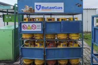 Sales rack with butane gas bottles at a gas station, Romania