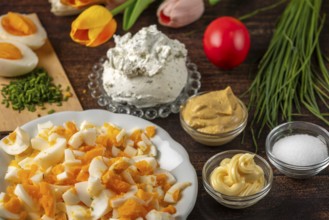 Ingredients for egg cream, such as cream cheese, sliced eggs and chives