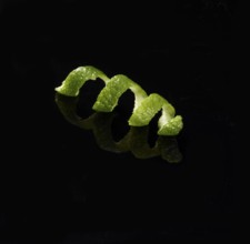 Lime zest against a black background, studio shot