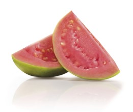 Two quarters of a sliced guava (Psidium guajava) in front of a white background, studio photo