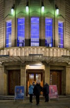 Visitors go to the theatre, entrance area Altes Schauspielhaus, façade, illuminated, Stuttgart,
