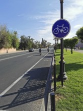 Bicycle path in Marrakech, with road sign, on a sunny day, Marrakech, Morocco