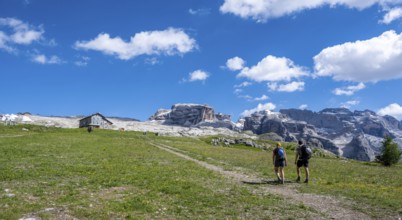 Hikers in front of Rifugio Graffer, Brenta, Brenta-Adamello Natural Park, Trentino, Italy
