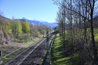 View from a bridge on railroad tracks and the Alps, Oberaudorf, Bavaria, Germany