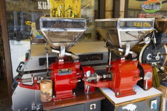 Coffee grinders and beans in a traditional shop, red coffee making machines, Konya, Central