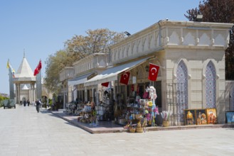 Street scene with shops and waving flags, architectural style, souvenir shops, in the background