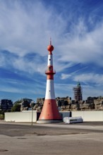 White-red lighthouse under cloudy sky on the coast, The City of Bremen