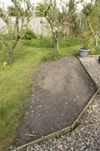 Garden border ready to be sown with wildflowers in spring, England, United Kingdom
