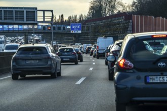 Driving on the A40 motorway, Ruhrschnellweg, in heavy traffic, drivers' perspective, Bochum, North