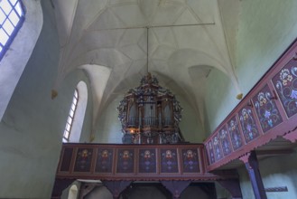 Gallery with baroque organ of the abandoned 16th century Protestant fortified church, Tobsdorf,