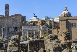 View of Roman Forum, in front ruin of temple of the Divine Caesar Julius Caesar, behind in the