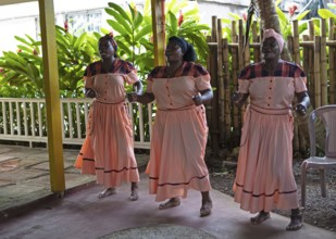 Guatemalan woman in traditional clothing singing and dancing, Garifuna people, Livingston, Izabal