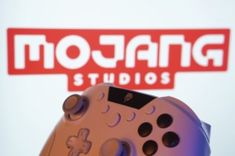 Dhaka, Bangladesh- 20 Mar 2025: A close-up of a white gamepad with the Mojang Studios seen on
