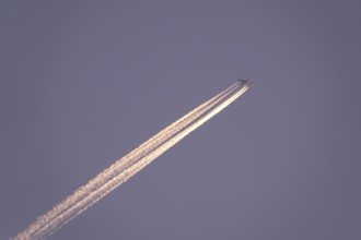 Airplane with contrails, Germany