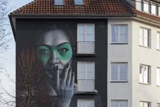 Portrait of a Eurasian woman, Rasimin, mural by street artist Fin DAC, Düsseldorf, North