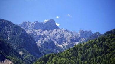 Mountain massif with rocky peaks and forest, Slovenia