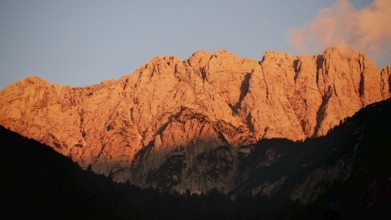 Close-up of mountains at sunset, alpine glow, with gold-lit rocks, Slovenia