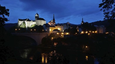 Night view of an illuminated castle and city on a river, Loket, Czech Republic