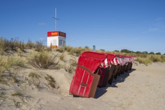 Red beach chairs next to each other on a sandy beach, DLRG Wasserrettung, Lobbe, Mönchgut, Rügen,