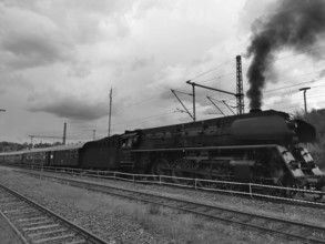 Historic steam locomotive on rails, smoke rises into the sky, Rennsteig, Frankenwald nature park