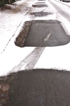 Traces of cars in winter with snow, Germany