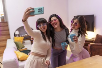 Group of happy young women friends wearing stylish sunglasses and holding drinks, capturing a fun