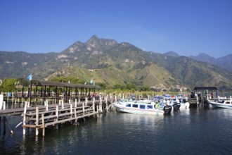 Colourful boats in the port of San Juan la Laguna, the mountains behind, Atitlán, Sololá