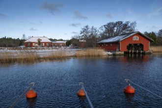 Falunred painted house and boathouse, Korpoström, Korpo or Korppo, southwestern archipelago,