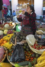 Mayan woman wearing traditional clothes at the market in Sololá, Highlands, Sololá Department,