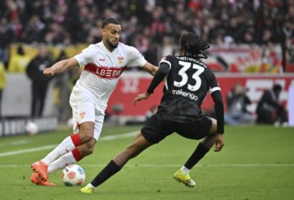 Tackle, action Josha Vagnoman VfB Stuttgart (04) against Jordy Makengo SC Freiburg SCF (33) Soccer