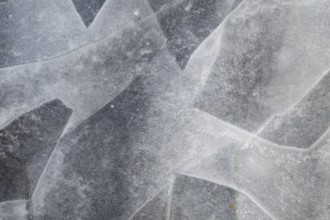 Ice sheets form abstract pattern on a frozen lake, ice, winter, Finland