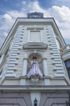 Mannequin in Ukrainian traditional costume in a niche at a 19th-century house, Czernowicz, Ukraine